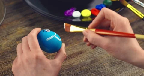 Easter christian holiday during coronavirus pandemic. Female hands painting Stock Footage 150962139