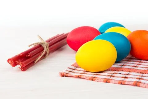 Easter colored eggs and candles napkin Stock Photos