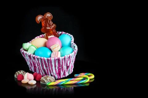 Easter colored eggs and sweets Фото