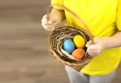Easter colored eggs in a basket close-up Stock Photos