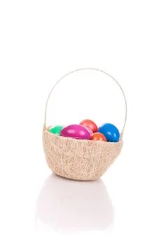 Easter colored eggs in the basket Stock Photos