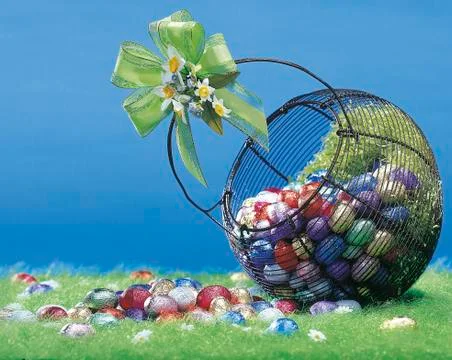 Easter colored eggs in the basket Stock Photos