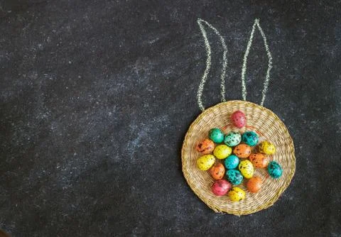 Easter colored eggs on a black background, concept Easter Stock Photos