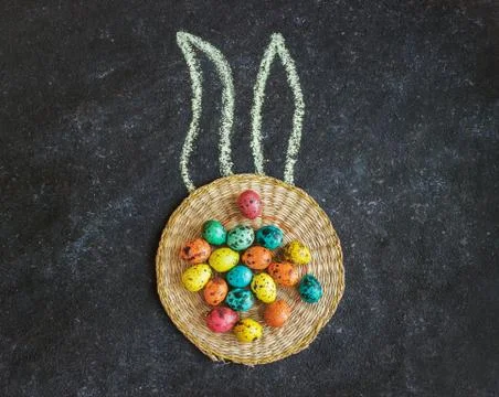Easter colored eggs on a black background, concept Easter Stock Photos