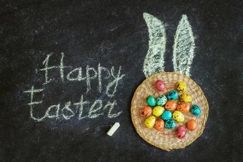Easter colored eggs on a black background, concept Easter Stock Photos