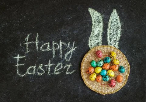 Easter colored eggs on a black background, concept Easter Stock Photos