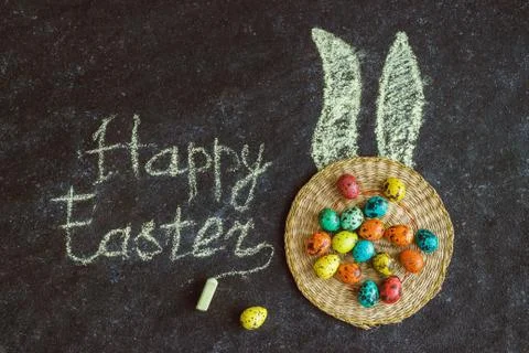 Easter colored eggs on a black background, concept Easter Stock Photos
