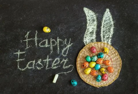 Easter colored eggs on a black background, concept Easter Stock Photos