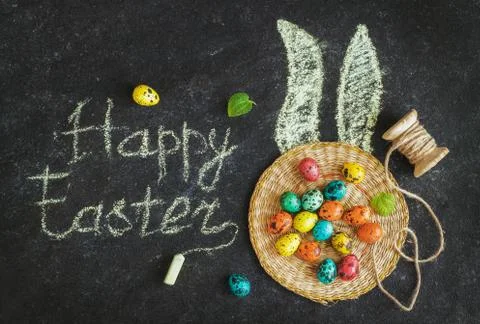 Easter colored eggs on a black background, concept Easter Stock Photos