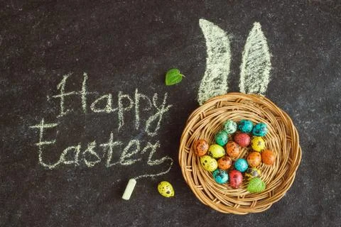 Easter colored eggs on a black background, concept Easter Stock Photos