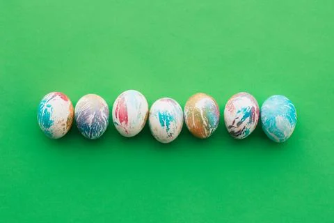 Easter colored eggs on a green background Stock Photos