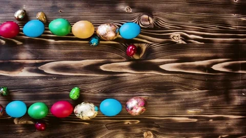 Easter colored eggs laid out on a table in two parallel rows. Video stock 85957370