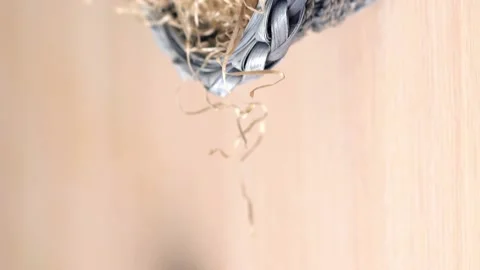 Easter colored eggs lying in the dried grass in a blue basket. Horizontal wiring Stock Footage 130897558