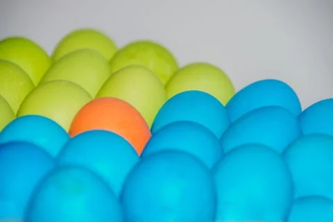 Easter colored eggs multicolour closeup one stands out Stock Photos