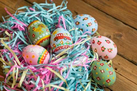 Easter colored eggs in the nest Stock Photos