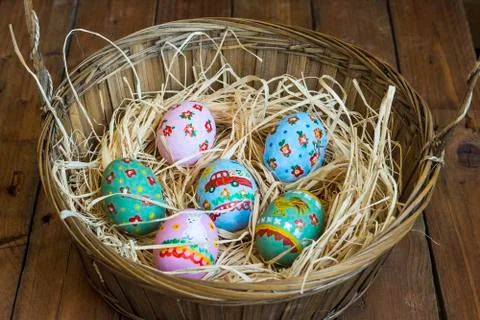 Easter colored eggs in the nest Stock Photos
