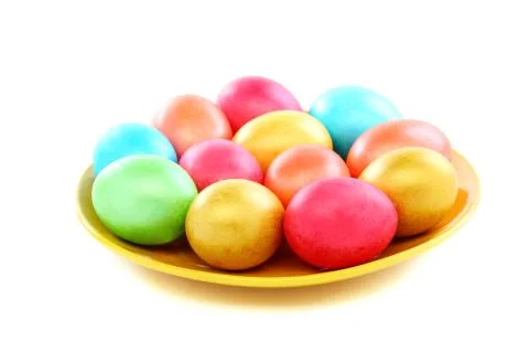 Easter colored eggs on a plate. Stock Photos