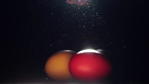 Easter colored eggs in a ray of light Stock Footage 258838086