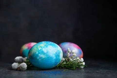 Easter colored eggs with spring flowers Stock Photos