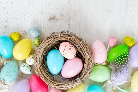 Easter colored eggs with tulips Stock Photos