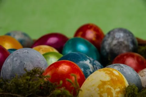 Easter, colored painted eggs with moss Stock Photos