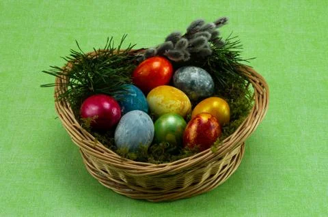 Easter, colored painted eggs in a wicker basket with moss Stock-Fotos