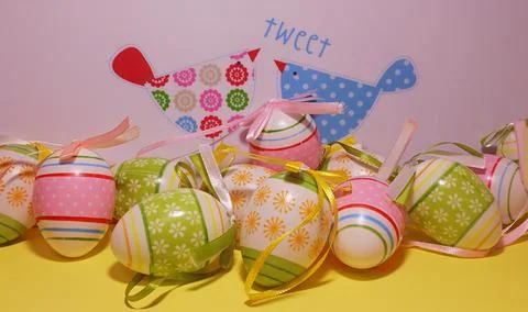 Easter, colorful Easter eggs with two colorful easter chicken. Stock Photos