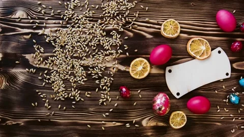 Easter colorful eggs, chicken and quail, lie on wooden table. Stock Footage 85932367