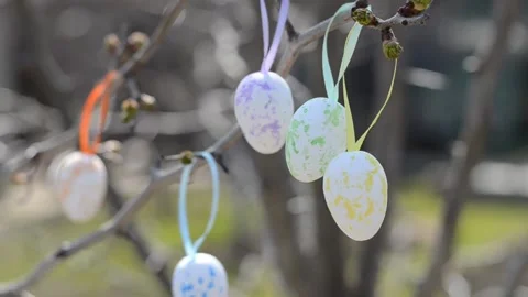 Easter colorful eggs hang on the branches of a tree. Easter composition Stock Footage 151314474