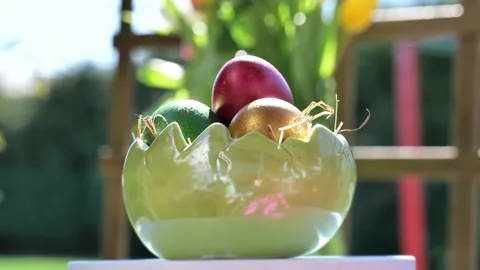 Easter colorful eggs rotate in nest with hey outdoor in sunny warming day. Stock-Footage 234547990