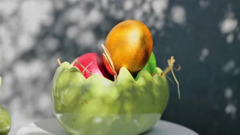 Easter colorful eggs rotate in nest with hey outdoor in sunny warming day. Video stock 234548174