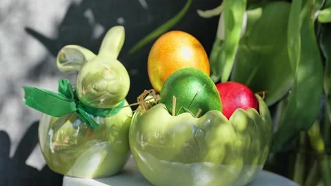 Easter colorful eggs rotate in nest with hey outdoor in sunny warming day. Stock Footage 234548231