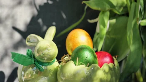 Easter colorful eggs rotate in nest with hey outdoor in sunny warming day. 스톡 동영상 234548291