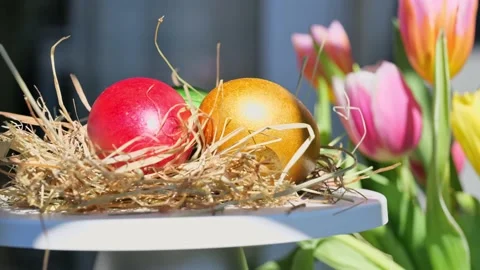 Easter colorful eggs rotate in nest with hey outdoor in sunny warming day. Video stock 234548851