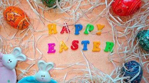 Easter composition with bunnies, Easter eggs and words Happy Easter Stock Footage 103852043