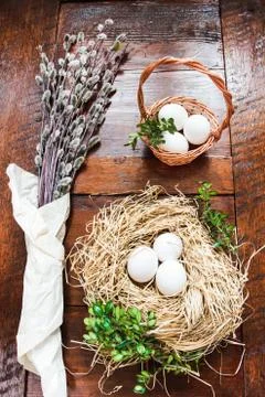 Easter composition of catkins and eggs on wooden table Stock-Fotos