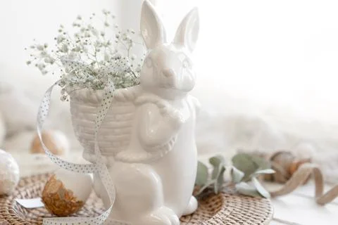 Easter composition with a ceramic hare and gypsophila flowers. Stock Photos