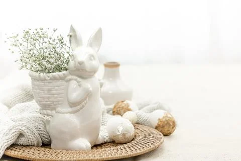 Easter composition with a ceramic hare and eggs. Stock Photos