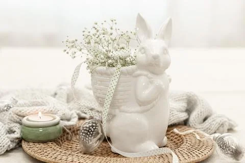 Easter composition with a ceramic hare and gypsophila flowers. Stock Photos
