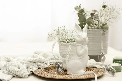 Easter composition with a ceramic hare and gypsophila flowers. Stock Photos