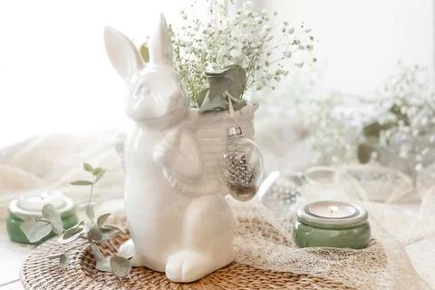 Easter composition with a ceramic hare and gypsophila flowers. Stock Photos