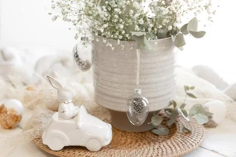Easter composition with a ceramic hare and gypsophila flowers. Stock Photos
