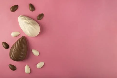 Easter. Composition with chocolate Easter eggs on colored background. Stock Photos