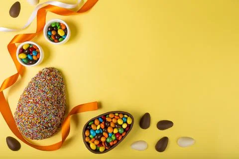 Easter. Composition with chocolate Easter eggs on colored background. Stock Photos