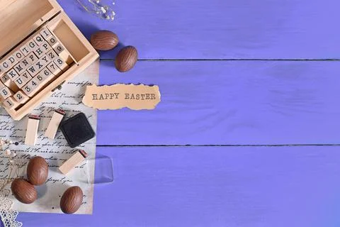 Easter composition. chocolate eggs, letters for a stamp, a letter on the Very Stock Photos