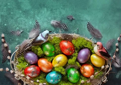 Easter composition with colorful Easter eggs and branches of pussy willows. Stock Photos