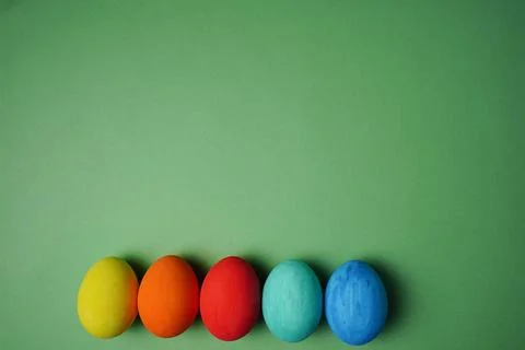 Easter composition. Colorful easter eggs on green background. The minimal con Stock Photos