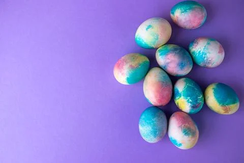 Easter composition with colorful eggs in shopping cart, wooden bunny and sp.. Stock Photos