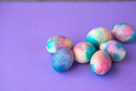 Easter composition with colorful eggs in shopping cart, wooden bunny and sp.. Stock Photos