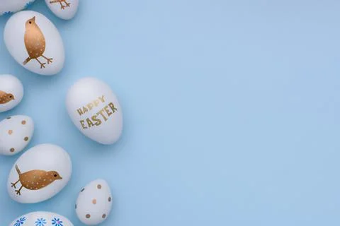 Easter composition of decorated eggs on a blue background. Stock Photos